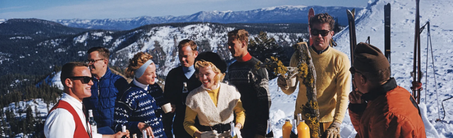 Friends celebrating on a snowy mountain